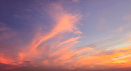Colorful sky in twilight time background. Beautiful red tone sky at sunset time. Colorful evening sky, Vibrant sky with dramatic evening light.  Evening dramatic scenic sunset sky background.
