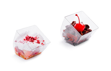 Dessert cups with whipped cream and cherries in clear containers