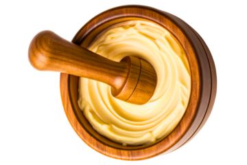 Wooden bowl and pestle with freshly churned butter isolated with transparent background