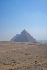 pyramids of giza on blue sky vertical