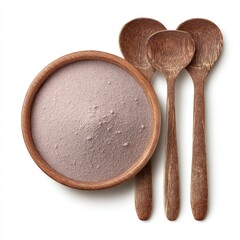 Wooden bowl of mauve powder; three dark wood spoons