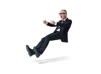 Shocked businessman driving an imaginary car and having an accident