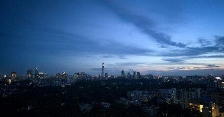 Night view at Dhaka city. Dhaka city skyline at night with glowing urban lights, beautiful modern cityscape of downtown capital, panoramic twilight view of illuminated buildings and blue evening sky