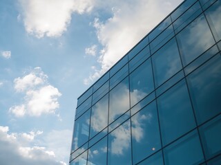 Modern Architecture. Sky and Clouds Reflected in the Glass Facade of Building.