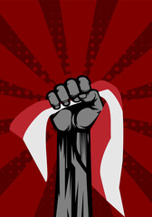 Raised arm fist hold red and white flag, background for heroic national day in Indonesia