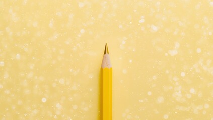 Yellow Pencil on a Golden Bokeh Background Creative Tools and Inspiration.