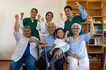 Senior man and women with grandchild feeling happy in home care with friendly caregiver team