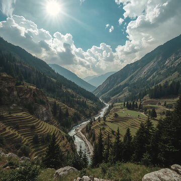 Pangi Valley in Himachal Pradesh is a tranquil, untouched valley with cliffs, pine forests, terraced fields, golden light, dramatic sky, mountains, and a meandering trail evoking wilderness and advent