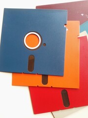 Colorful Vintage Floppy Disks Arranged on a Bright White Surface