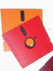 Colorful Vintage Floppy Disks Arranged on a Bright White Surface