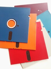 Colorful Vintage Floppy Disks Arranged on a Bright White Surface