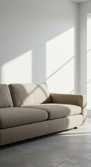 Light streams into a modern living space, highlighting a light beige sofa against a bright white wall.