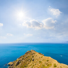Fototapeta premium stony sea cape with huge stones near a coast at the summer sunny day