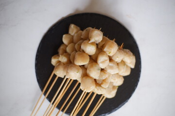 a plate of pentol cilok 