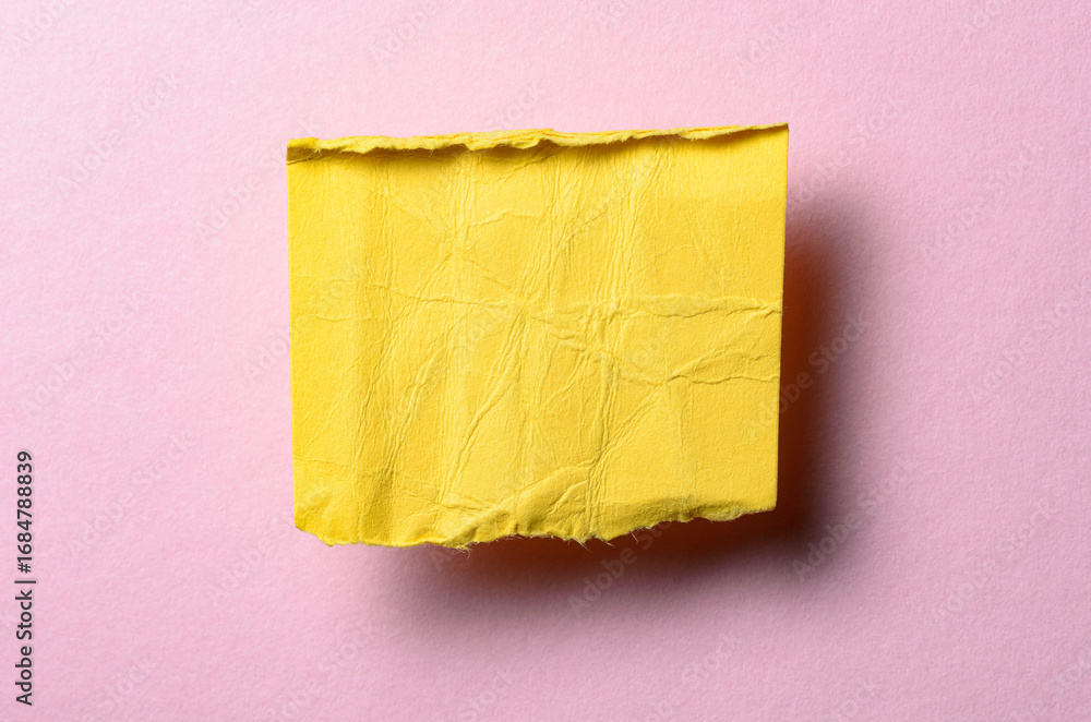 Poster one single yellow torn ripped wrinkled crumpled blank paper note with drop shadow, folded edge and c