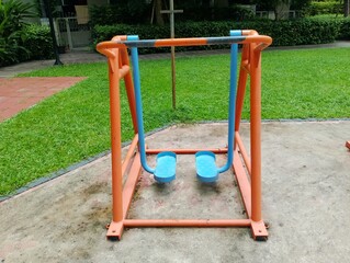 Outdoor fitness equipment community park playground structure green space ground level wellness promotion