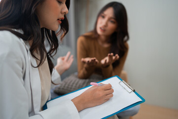 A therapist listens intently to their client during a deeply engaging counseling session