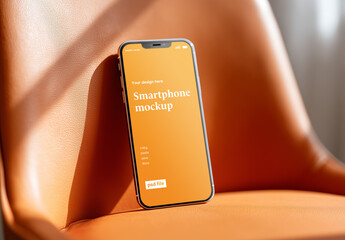 Closeup of mobile phone on interior chair mockup