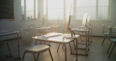 Modern Educational Space with Computer Desks, White Monitors. Computer Science Classroom Prepared for Interactive Learning, Digital Skills Training and Technology-Based School Activities. Dolly Shot.