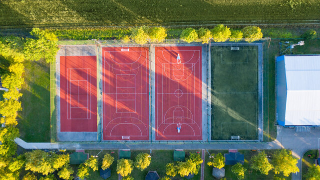 Aerial view of outdoor football, basketball, and tennis courts in a sports center