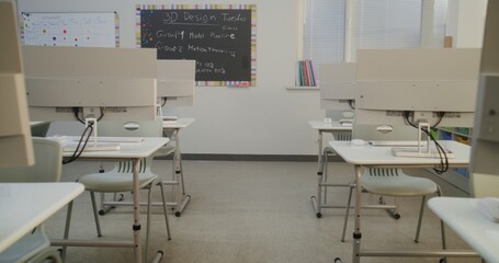 Modern Educational Space with Computer Desks, White Monitors. Computer Science Classroom Prepared for Interactive Learning, Digital Skills Training and Technology-Based School Activities. Dolly Shot.