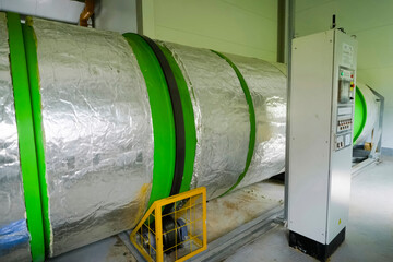 Rotating cylinder with, manure inside. Cow manure processing equipment