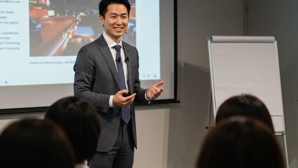 Young Asian Businessman Delivering a Professional Presentation