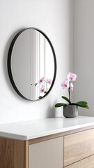 Round mirror on white vanity