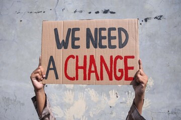 Person Holding a Banner of 