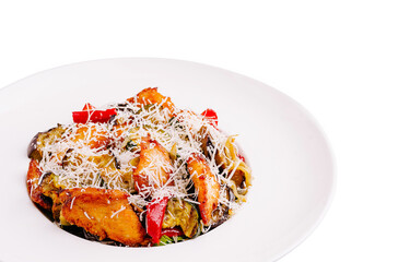 Delicious plate of pasta with vegetables and cheese served in restaurant setting