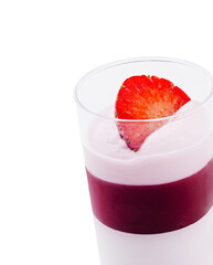 Strawberry dessert with creamy layers in a clear glass on a white background