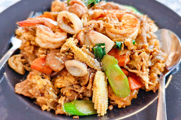 Delectable Seafood Dish: An appetizing close-up showcases a vibrant plate of a seafood delicacy, a...