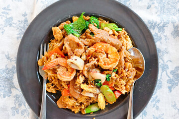 Exquisite Thai Fried Rice: An overhead shot showcases a plate of the world-renowned Thai fried rice, a colorful culinary masterpiece. The dish features generous portions of perfectly cooked rice.