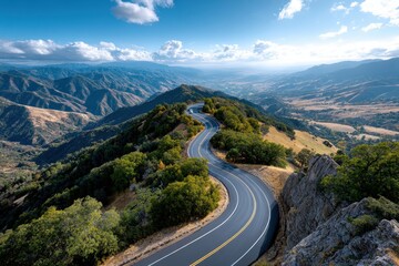 Naklejka premium Winding Mountain Road with Scenic Valley View