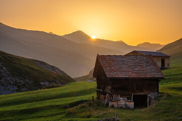 Sunset Over Rustic Cabin in Mountain Landscape, Juf village, Switzerland