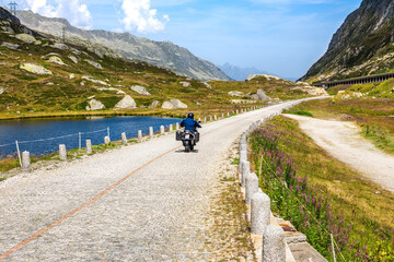 Motorcyclist on Scenic Gotthard Mountain Pass Road in Switzerland