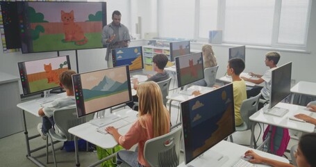 Elementary School Children Using Computers, Creating Digital Illustrations. African American Teacher Teaching Young Boys and Girls During Art Lesson Using Digital Screen. STEM Education. Static Shot. - Powered by Adobe
