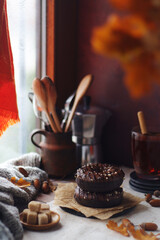 Chocolate donuts in an autumn style still life