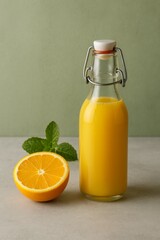 A refreshing orange juice bottle with a slice of orange and some mint leaves, evoking a sense of freshness and vitality. The juice is in a glass bottle with a unique lid, offering a visual feast.