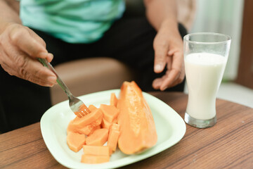 Im enjoying fresh papaya with milk for a nutritious breakfast to energize my day