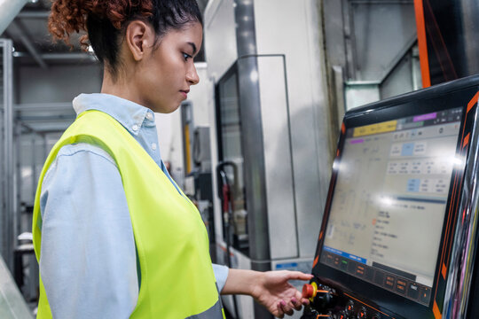 Engineer operating machinery with software in industry