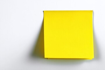 one yellow blank sticky notes on white background