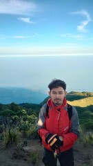 Naklejka premium hiker in the mountains, young man in the mountains