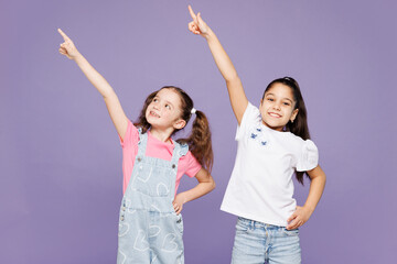 Little smiling cool two friends kids children girls 9-10 years old wear casual clothes together...