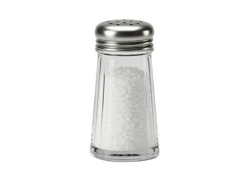 Isolated full clear glass salt shaker with a stainless steel cap and perforated top, food photography