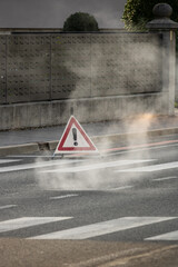 safety alert road scene with exclamation mark sign and smoke