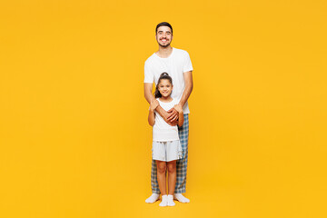 Full body young parent man with child girl wear casual blue pyjamas clothes Daddy little kid...