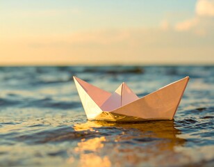 Paper boat on water at sunset (1)
