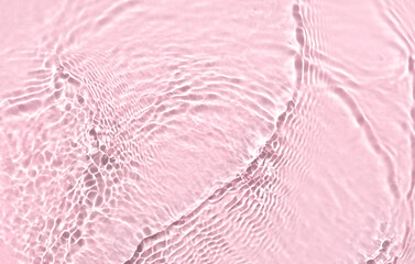 water texture ripples wave clean transparent water abstract background in pink color