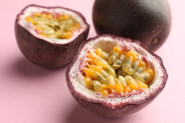 Fresh passion fruits on pink background, closeup